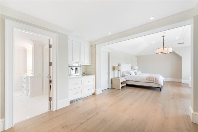 bedroom featuring light hardwood / wood-style floors and lofted ceiling