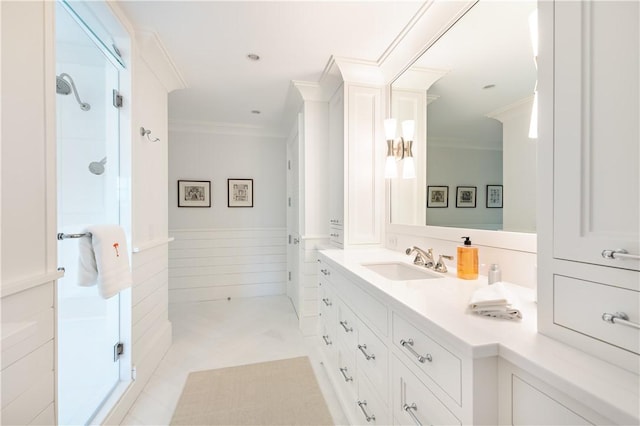 bathroom featuring tile patterned flooring, vanity, walk in shower, and ornamental molding