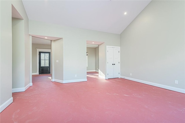 unfurnished room with a high ceiling