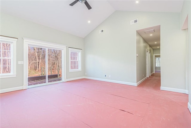 unfurnished room with ceiling fan and high vaulted ceiling