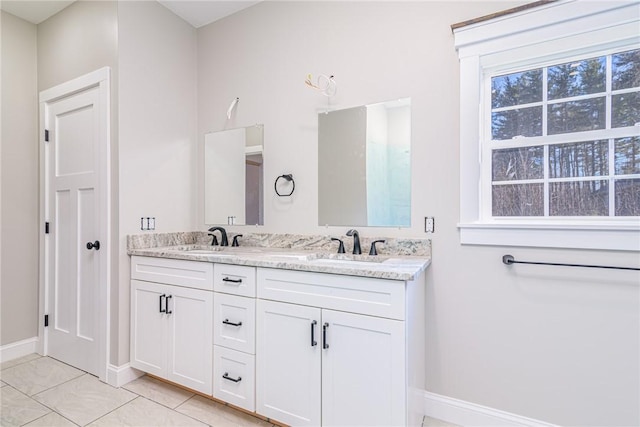 bathroom with tile patterned floors and vanity