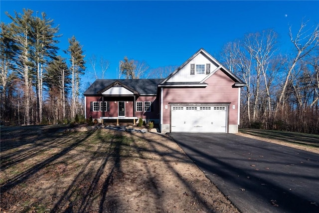 view of front of home with a garage and a front lawn