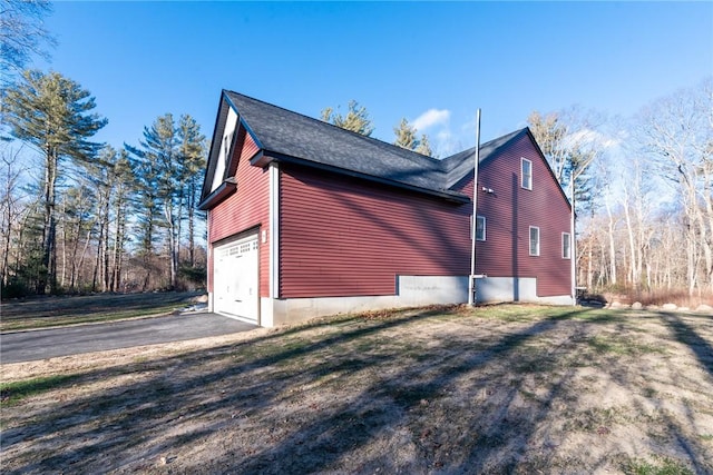 view of home's exterior with a garage