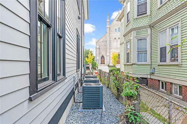 view of side of property featuring central AC