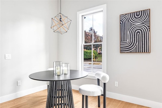 dining area with hardwood / wood-style floors