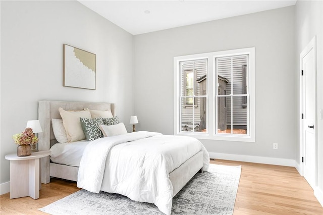 bedroom with light hardwood / wood-style floors