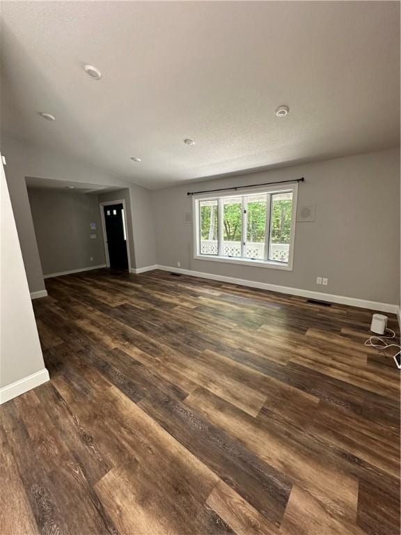 empty room with dark wood-type flooring