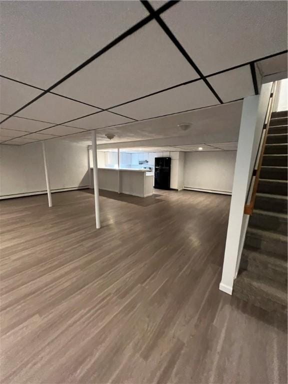 basement featuring dark hardwood / wood-style flooring