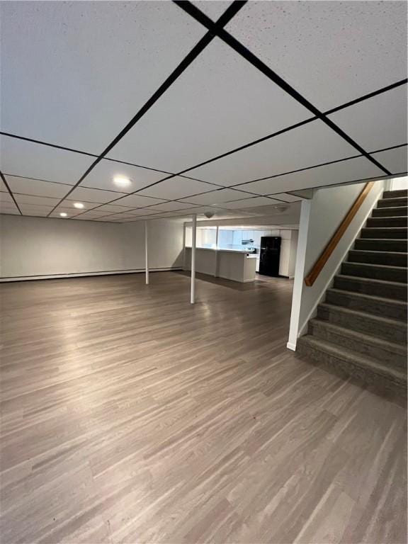 basement featuring hardwood / wood-style floors