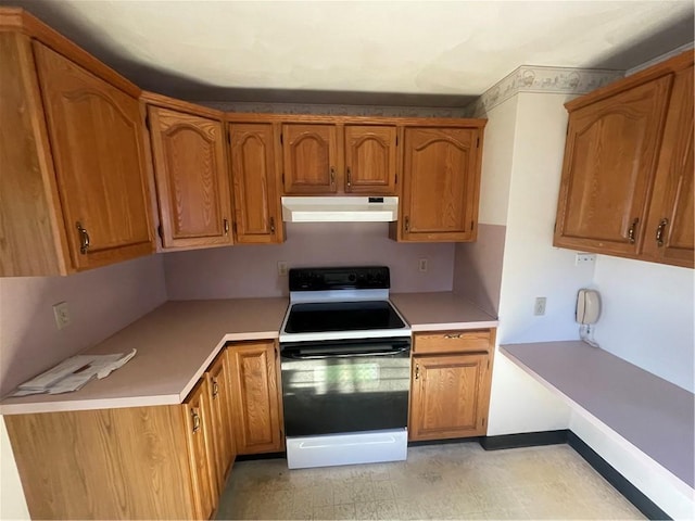 kitchen featuring white range with electric stovetop