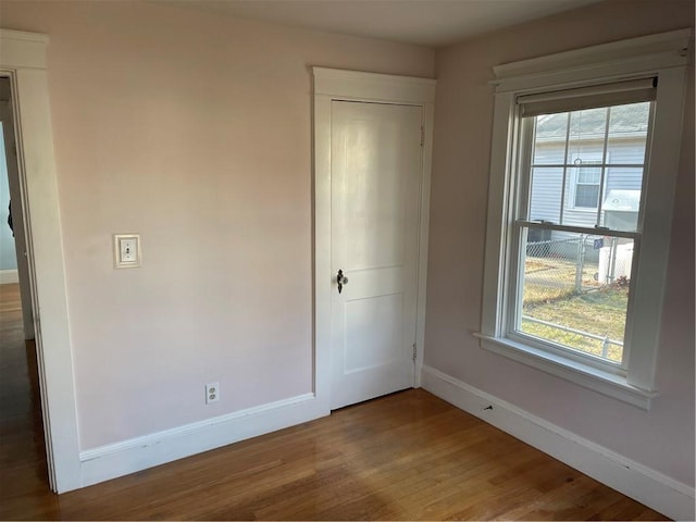 unfurnished bedroom with hardwood / wood-style floors