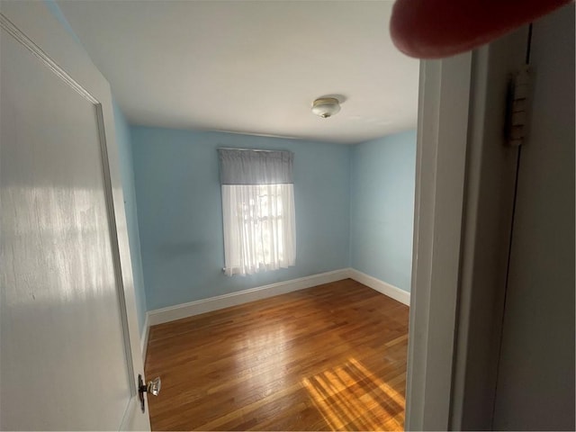 empty room featuring hardwood / wood-style floors