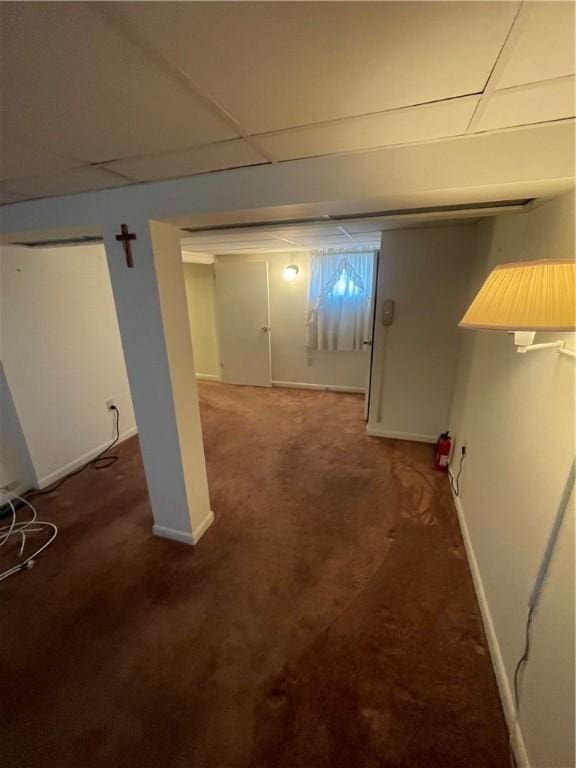 basement with dark carpet