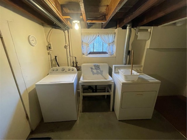 laundry room featuring sink and washing machine and clothes dryer