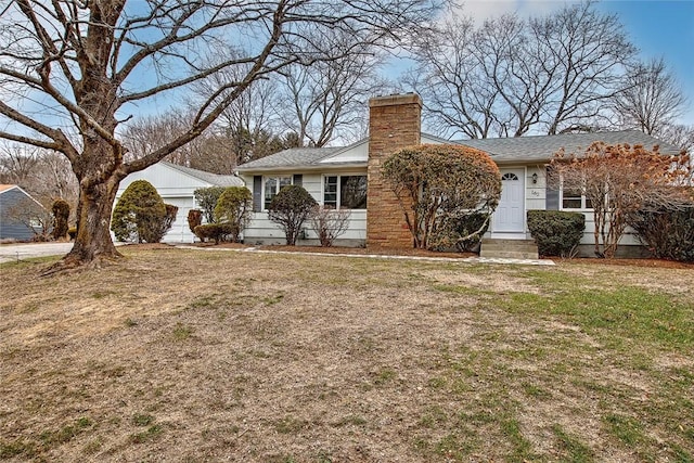 ranch-style home with a front yard