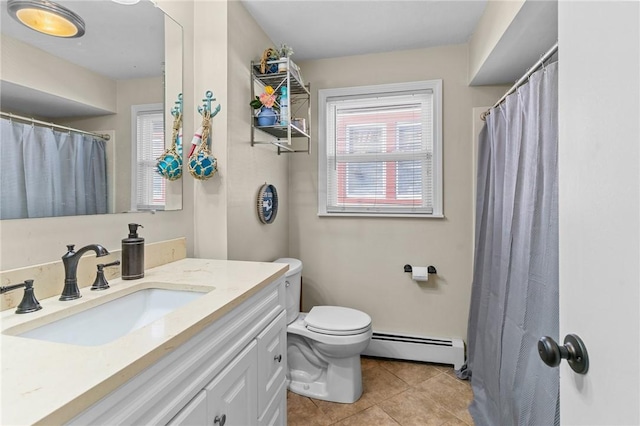 bathroom with tile patterned flooring, vanity, toilet, and a baseboard heating unit