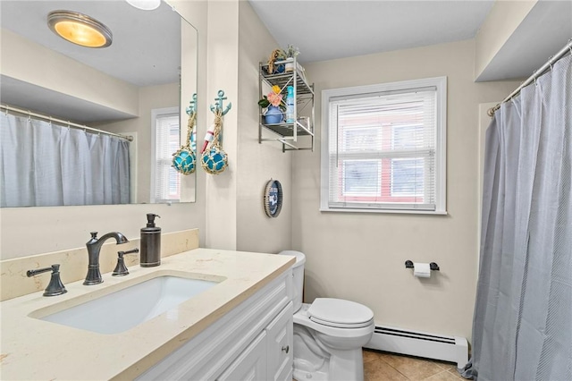 bathroom with toilet, vanity, tile patterned floors, and a baseboard heating unit