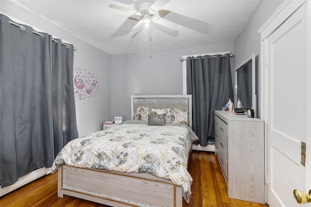 bedroom featuring dark hardwood / wood-style flooring and ceiling fan