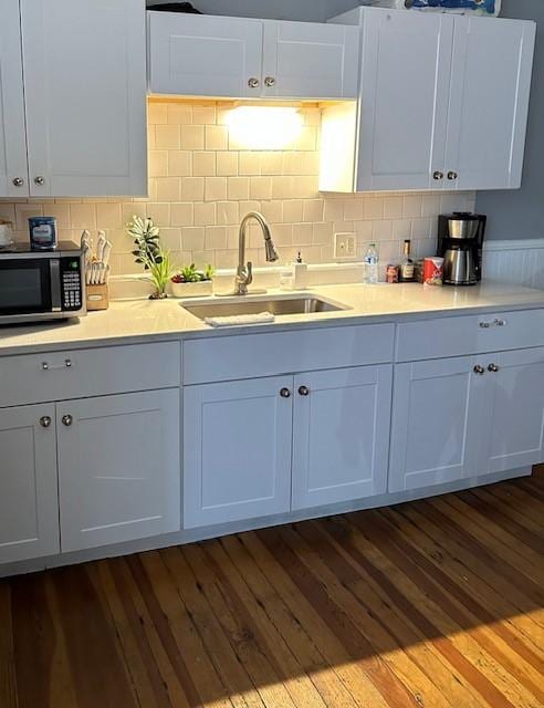 kitchen with white cabinetry and sink