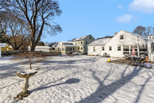 view of snow covered house