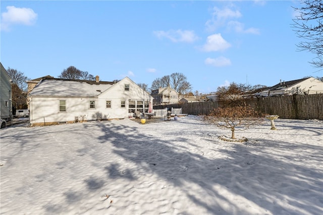 view of snow covered house