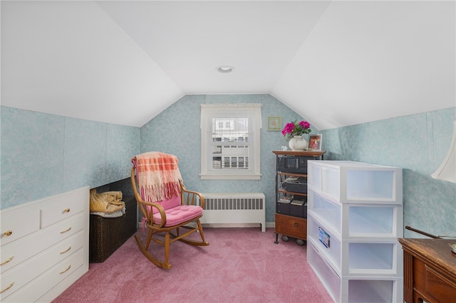 sitting room featuring carpet flooring, radiator, and lofted ceiling