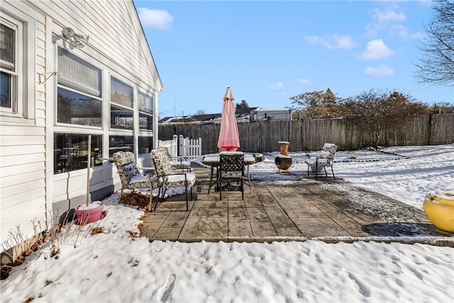 view of snow covered patio