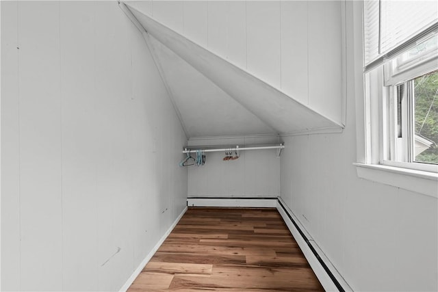 interior space featuring light wood-type flooring and lofted ceiling