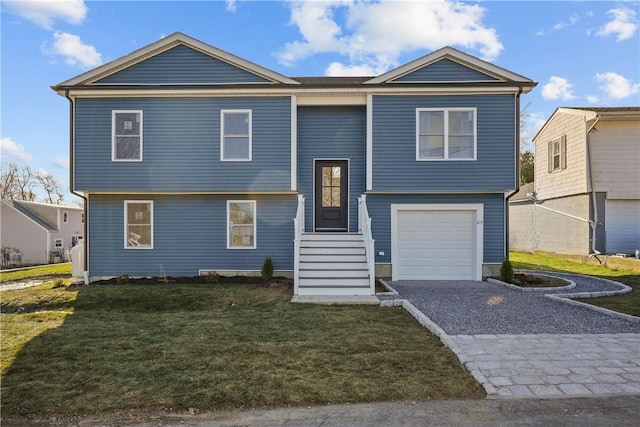 view of front facade with a front yard and a garage