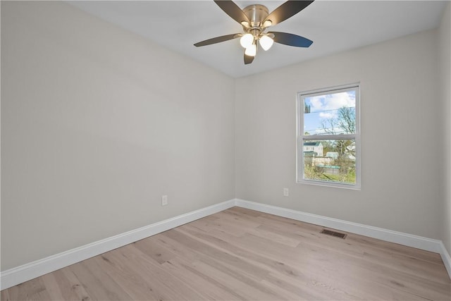 spare room with light hardwood / wood-style floors and ceiling fan