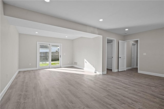 unfurnished room featuring light hardwood / wood-style floors