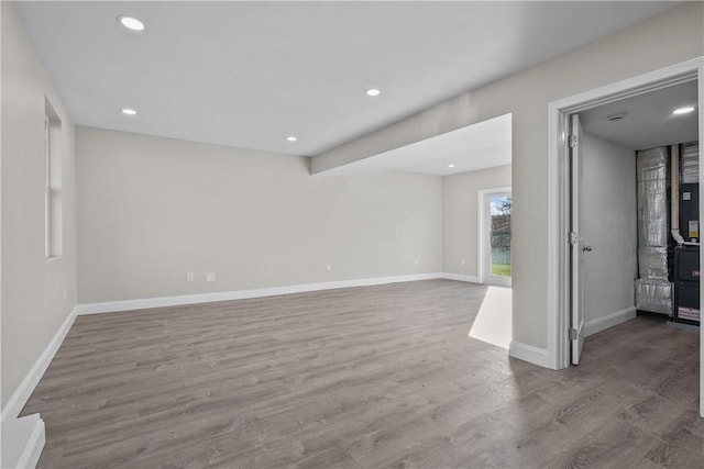 spare room with wood-type flooring