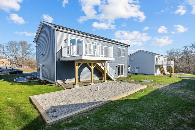 rear view of property featuring a lawn and a wooden deck