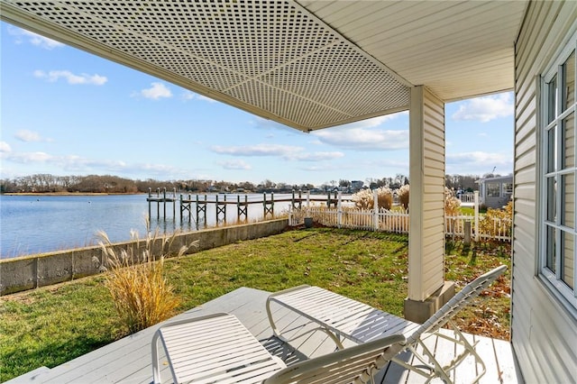 exterior space with a lawn and a water view