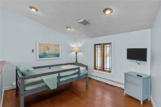 bedroom featuring hardwood / wood-style floors, lofted ceiling, and a baseboard radiator