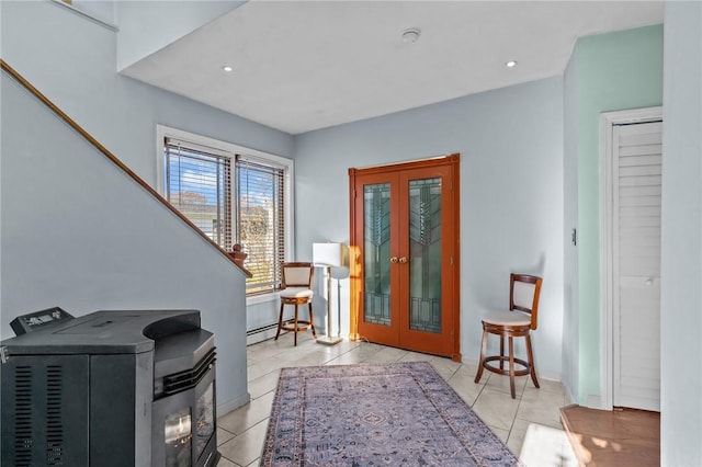 tiled entryway with french doors and a baseboard radiator