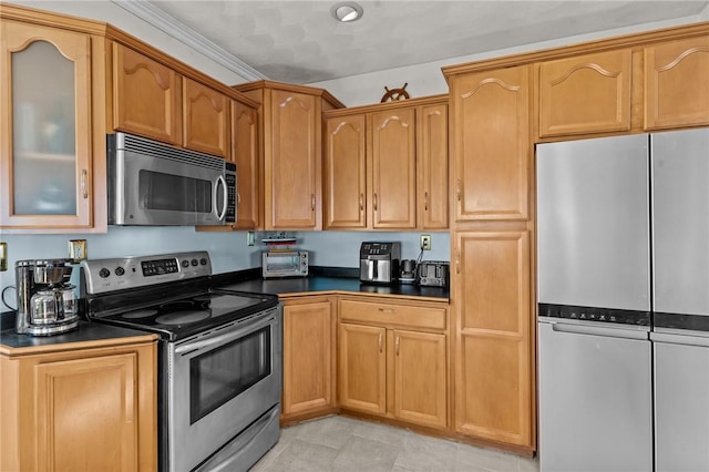 kitchen with ornamental molding and appliances with stainless steel finishes