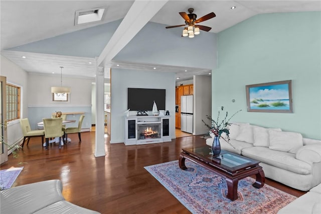 living room featuring hardwood / wood-style floors, ceiling fan, and lofted ceiling