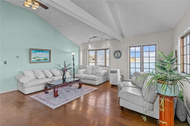 living room featuring rail lighting, baseboard heating, ceiling fan, dark wood-type flooring, and vaulted ceiling with beams