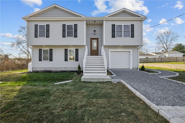 split foyer home with a front yard and a garage