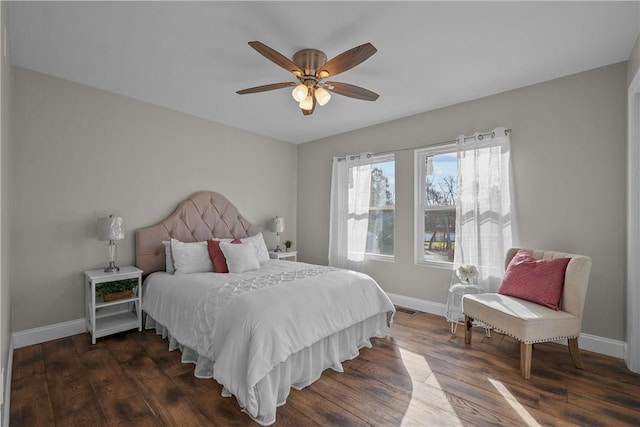 bedroom with ceiling fan and dark wood-type flooring