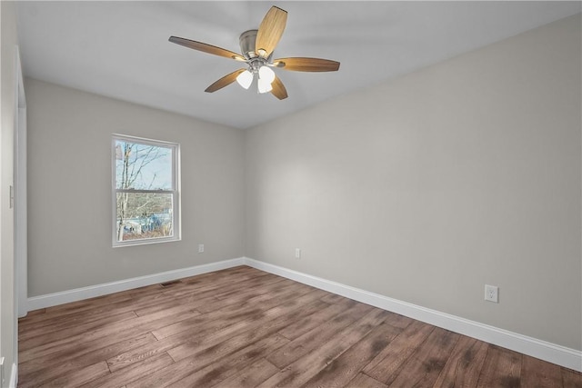 unfurnished room featuring hardwood / wood-style floors and ceiling fan