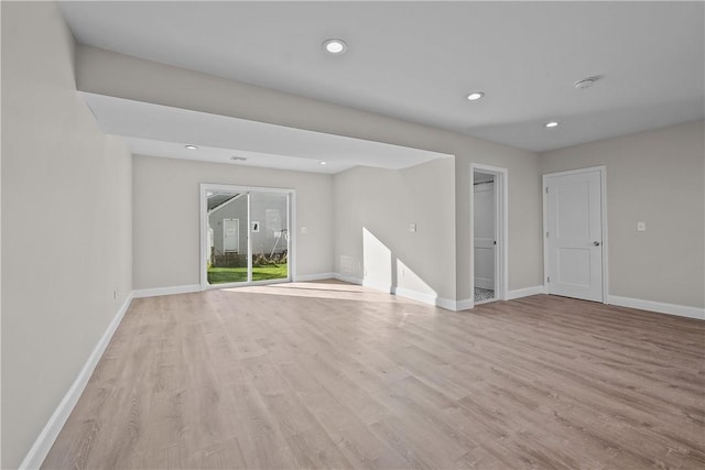 empty room with light hardwood / wood-style floors