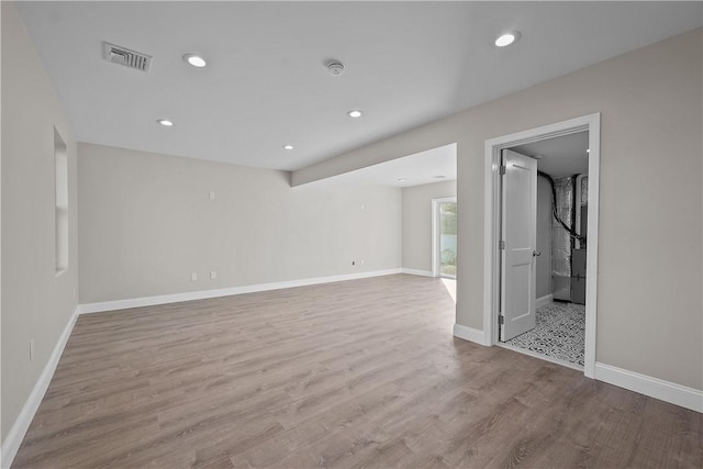 spare room featuring light hardwood / wood-style floors