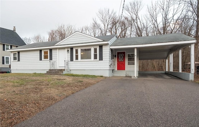 view of front of home featuring a carport