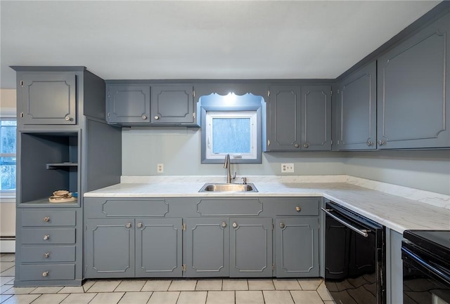 kitchen featuring gray cabinetry, dishwasher, sink, baseboard heating, and light tile patterned flooring