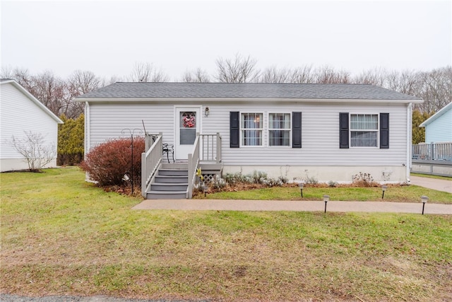 view of front of home featuring a front yard