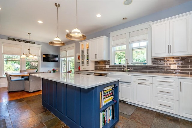 kitchen featuring white cabinetry and a healthy amount of sunlight