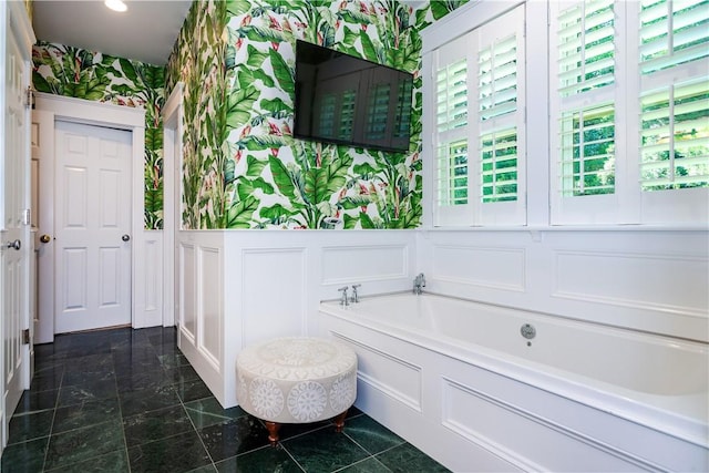 bathroom featuring a washtub