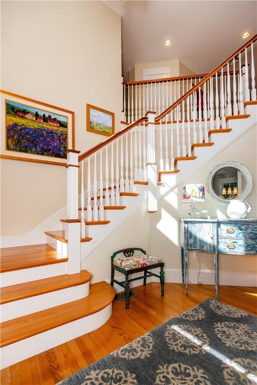 stairway featuring hardwood / wood-style floors